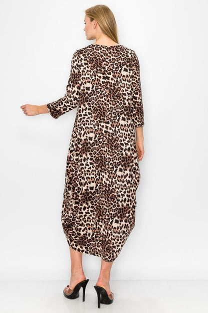 Leopard women's maxi dress with side pouch pockets by Casa Lee, featuring a flowing silhouette and stylish animal print.