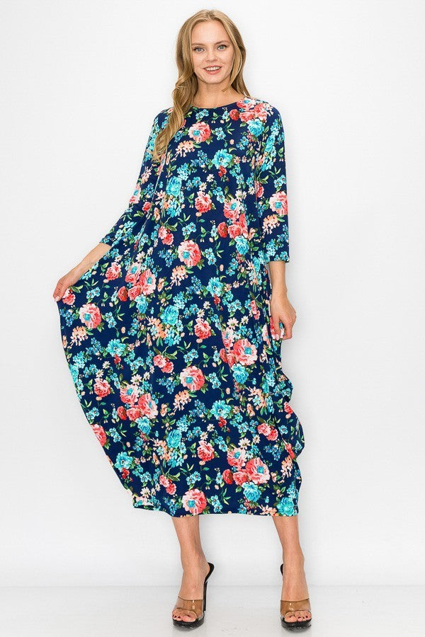 Navy pink floral women's bubble maxi dress with pockets by Casa Lee, featuring a flowing silhouette and vibrant floral pattern.