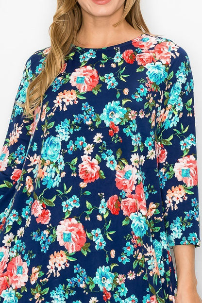 Navy pink floral women's bubble maxi dress with pockets by Casa Lee, featuring a flowy silhouette and vibrant floral pattern.