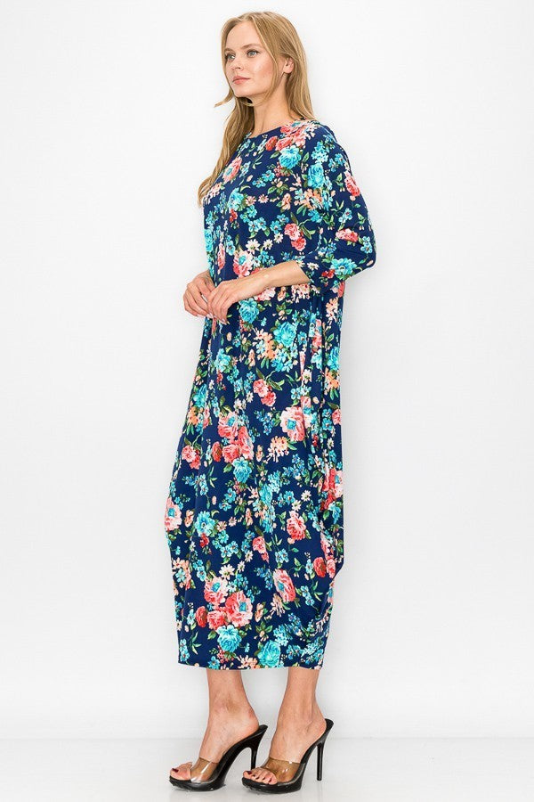 Navy pink floral women's bubble maxi dress with pockets by Casa Lee, featuring a flowy silhouette and vibrant floral pattern.