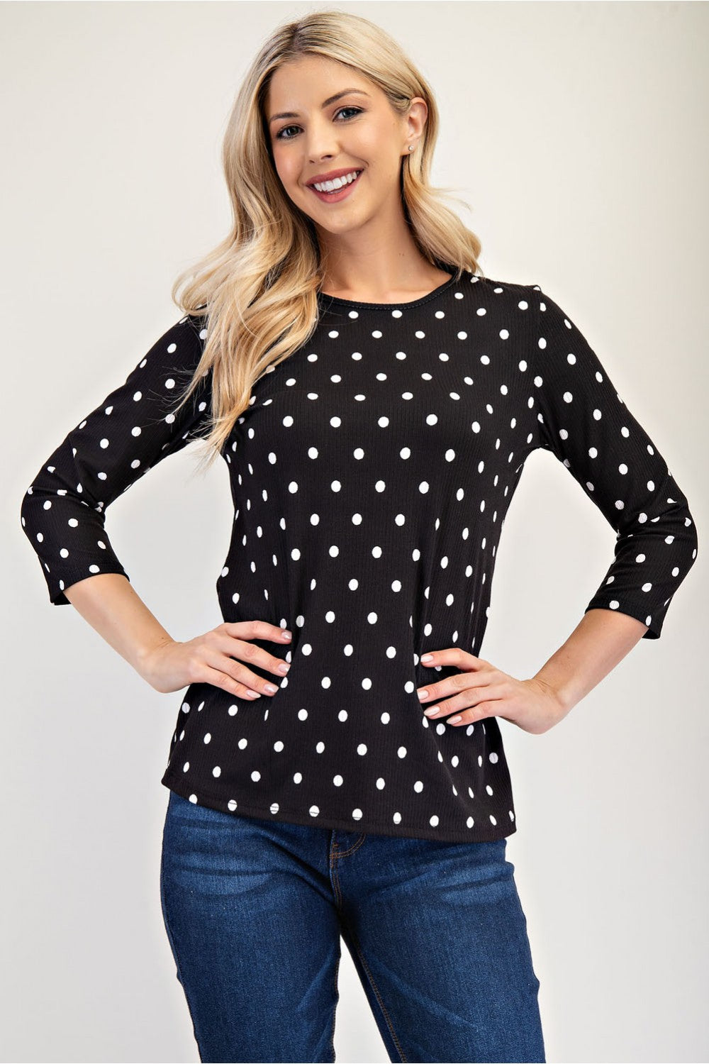 Black polka dot layering top by Celeste Clothing, missy regular size 3/4 sleeve shirt with a comfortable fit and stylish design.