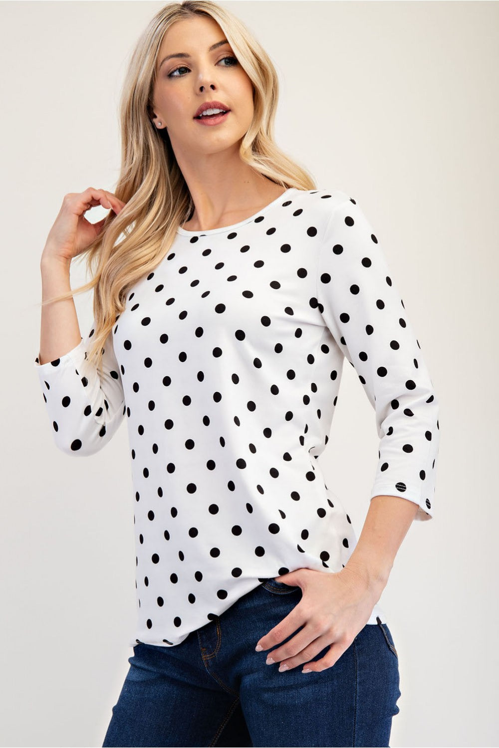 Black polka dot layering top by Celeste Clothing, 3/4 sleeve shirt with a relaxed fit, perfect for casual or layered outfits.