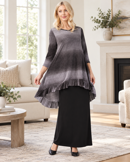 Black modish high-low ombre 3/4 sleeve top by Celeste Clothing, shown indoors.