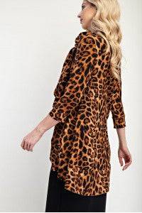 Leopard print A-line modest top with bow-tie detail and 3/4 sleeves by Celeste Clothing, stylish and feminine.