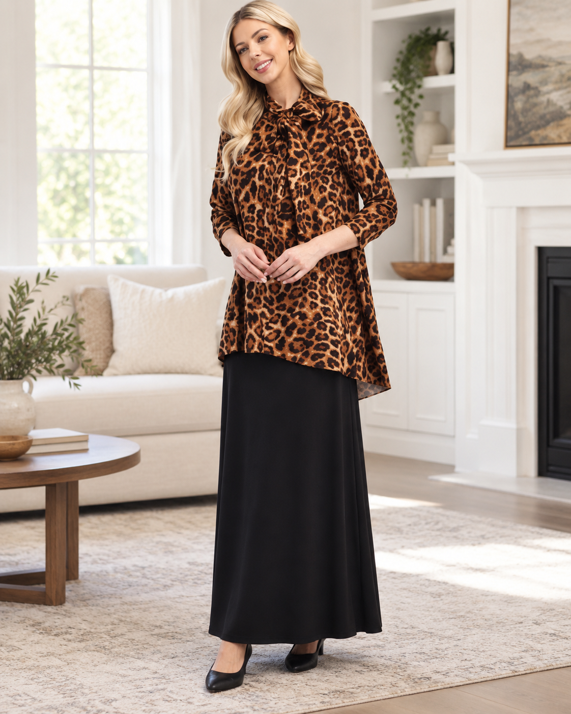 Leopard print bow-tie A-line modest top with 3/4 sleeves by Celeste Clothing, shown indoors.