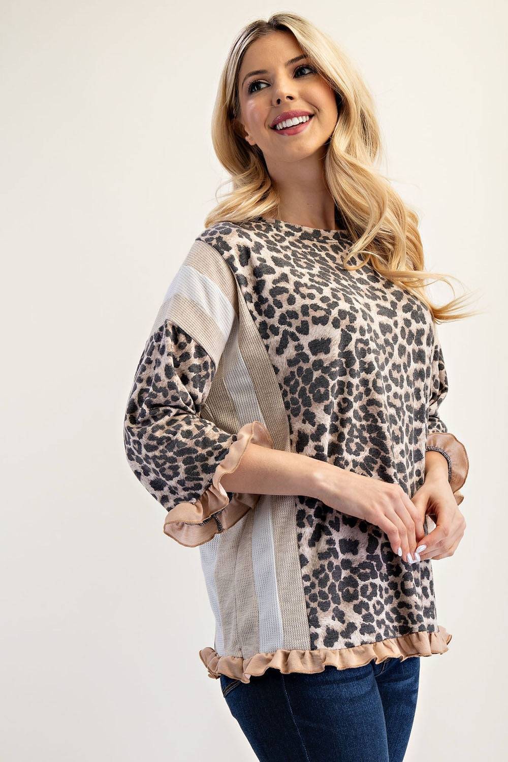Neutral leopard print 3/4 sleeve ruffle trim top by Celeste Clothing, showcasing stylish details and fabric texture.