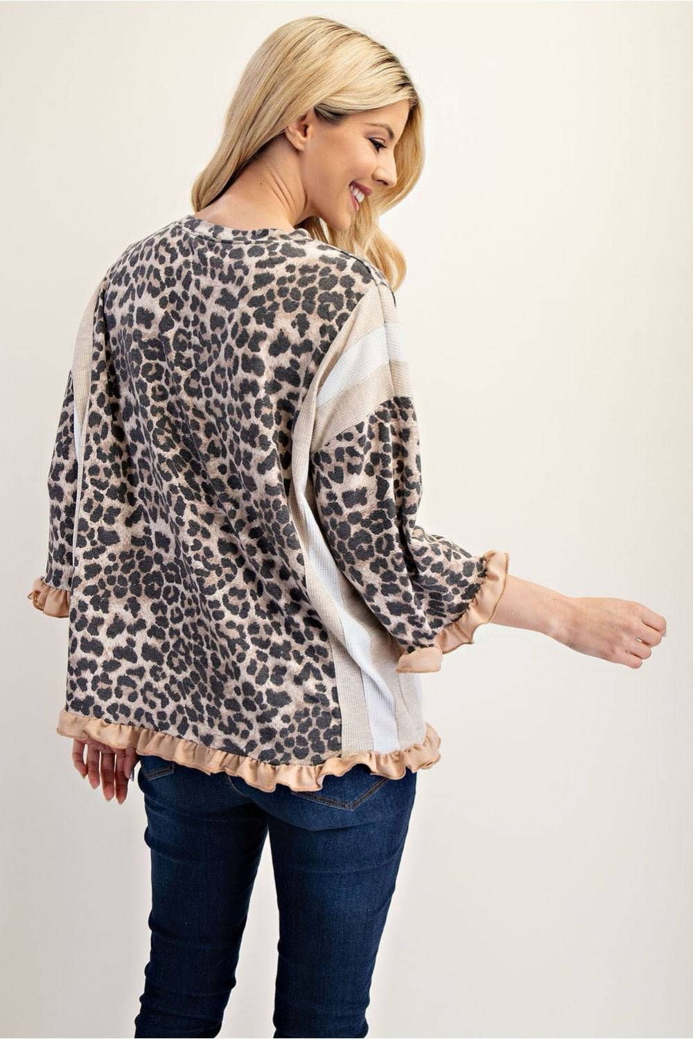 Neutral leopard print 3/4 sleeve ruffle trim top by Celeste Clothing, featuring a stylish, feminine design.