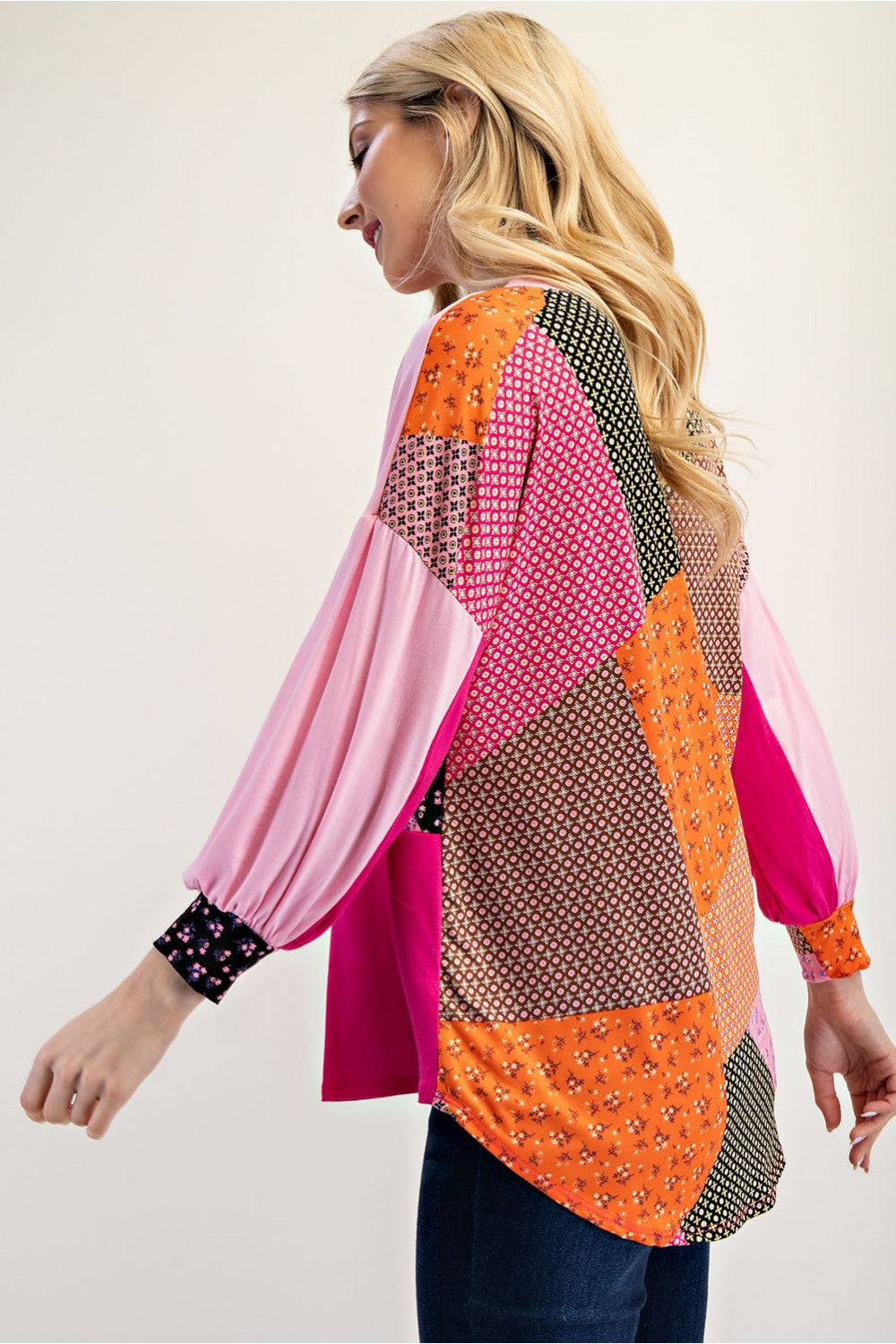Pink colorblock patchwork 3/4 sleeve top by Celeste Clothing, showcasing a stylish, casual women's blouse with mixed pink shades.