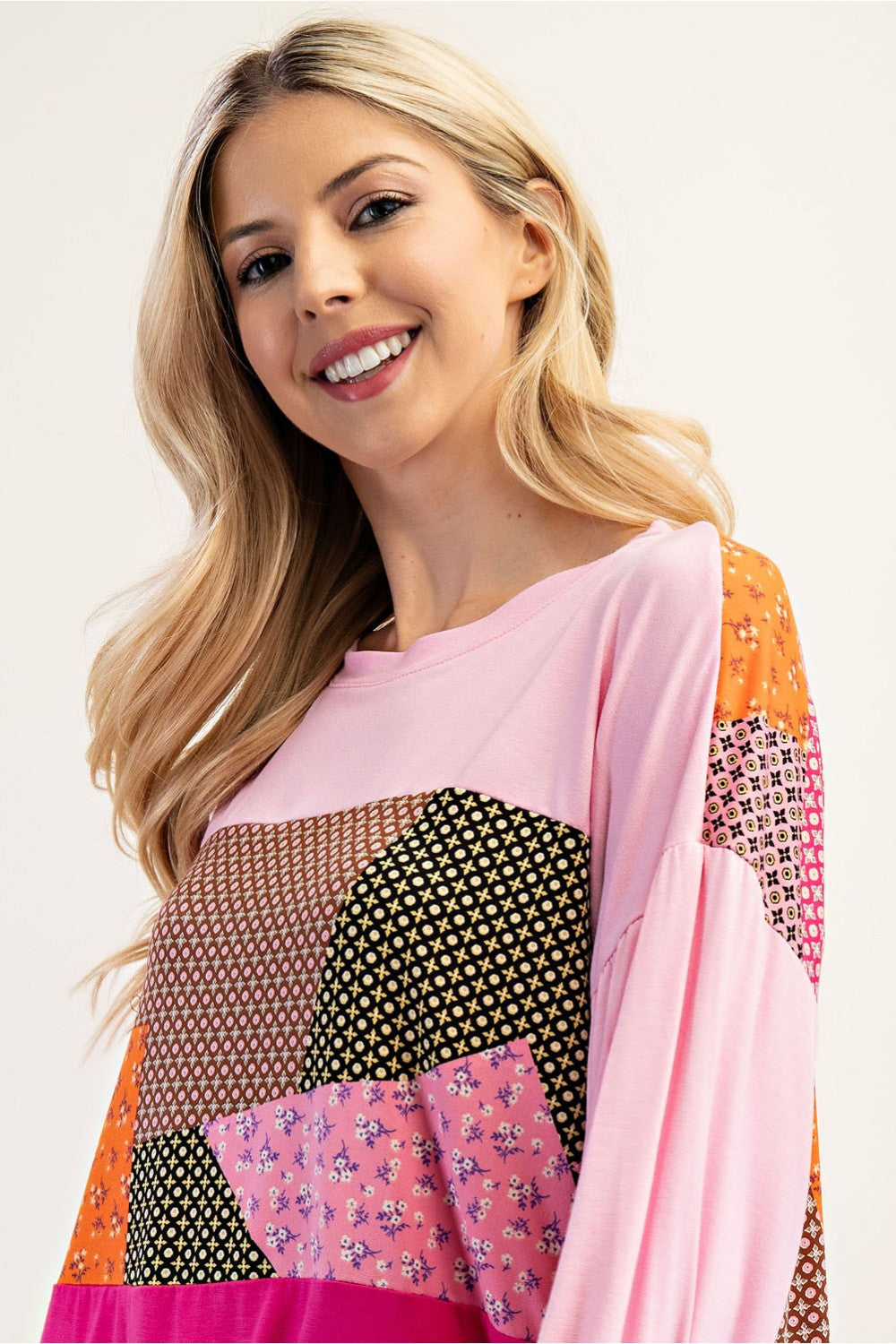 Pink patchwork colorblock 3/4 sleeve top by Celeste Clothing, showcasing a stylish and vibrant casual top.