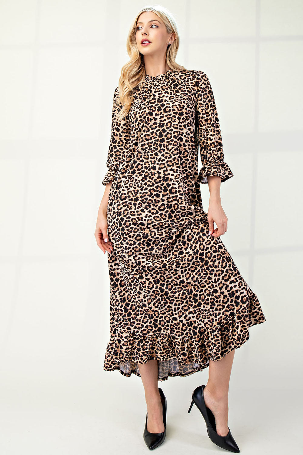 Plus size leopard print dress with 3/4 sleeves and ruffle trim by Celeste Clothing, featuring a stylish and comfortable design.