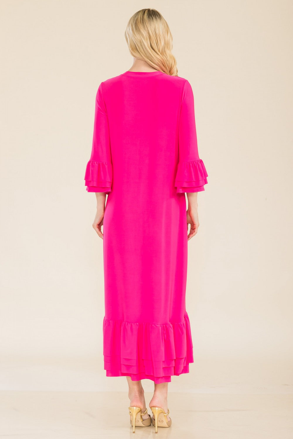 Pink plus-size modest 3/4 sleeve dress with ruffle bell sleeves from Celeste Clothing, displayed on a hanger.