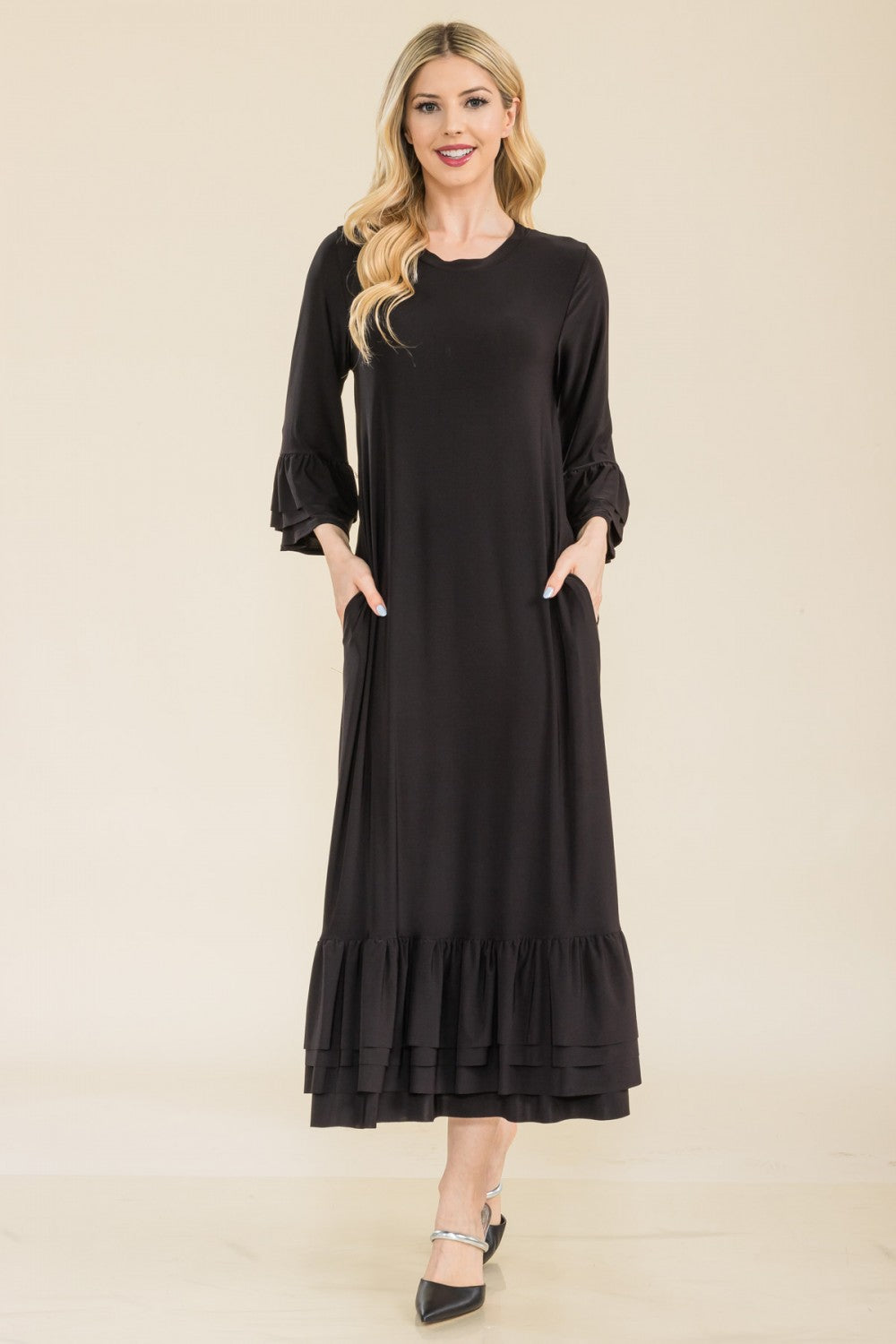 Pink plus-size modest 3/4 sleeve dress with ruffle bell sleeves from Celeste Clothing, styled with a flattering fit and elegant design.