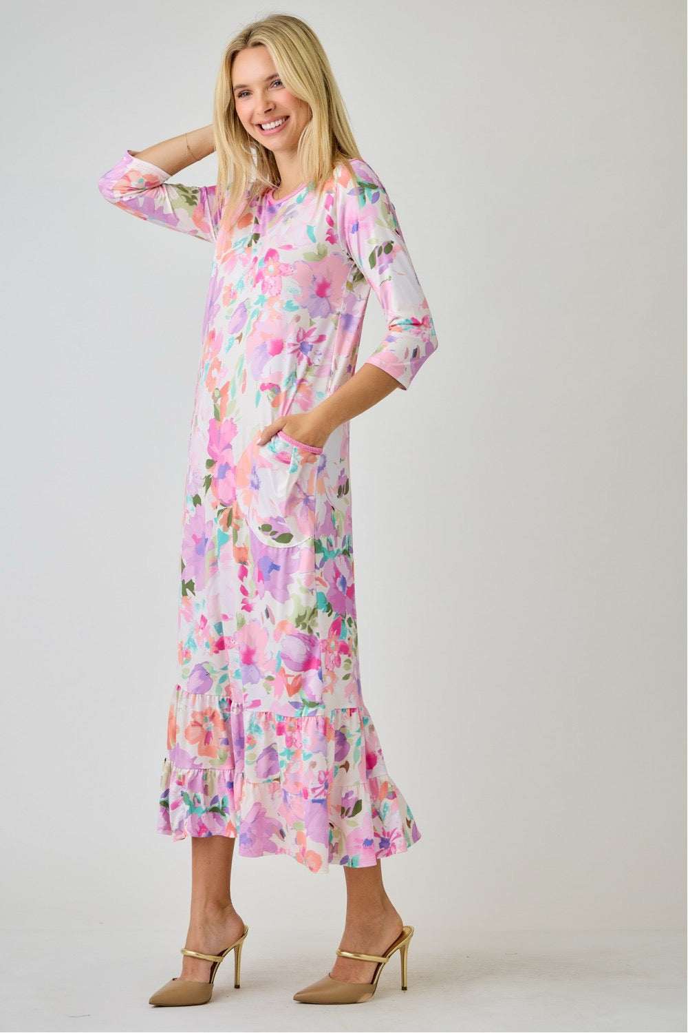 Navy watercolor floral tiered ruffle dress with pockets by Celeste Clothing, featuring summer floral print and ruffled details.