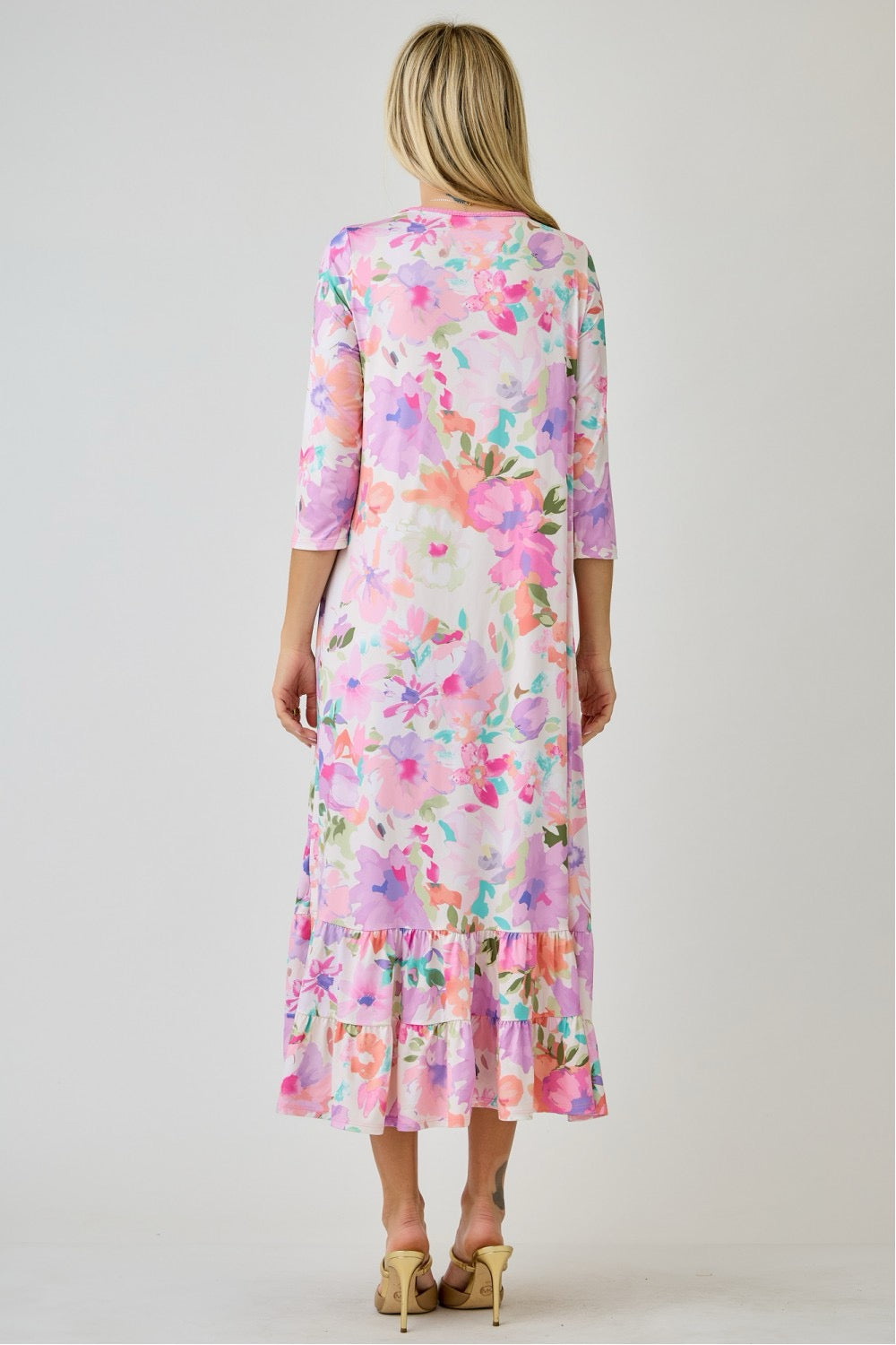 Navy watercolor floral tiered ruffle dress by Celeste Clothing with pockets, perfect for summer, shown on a model.