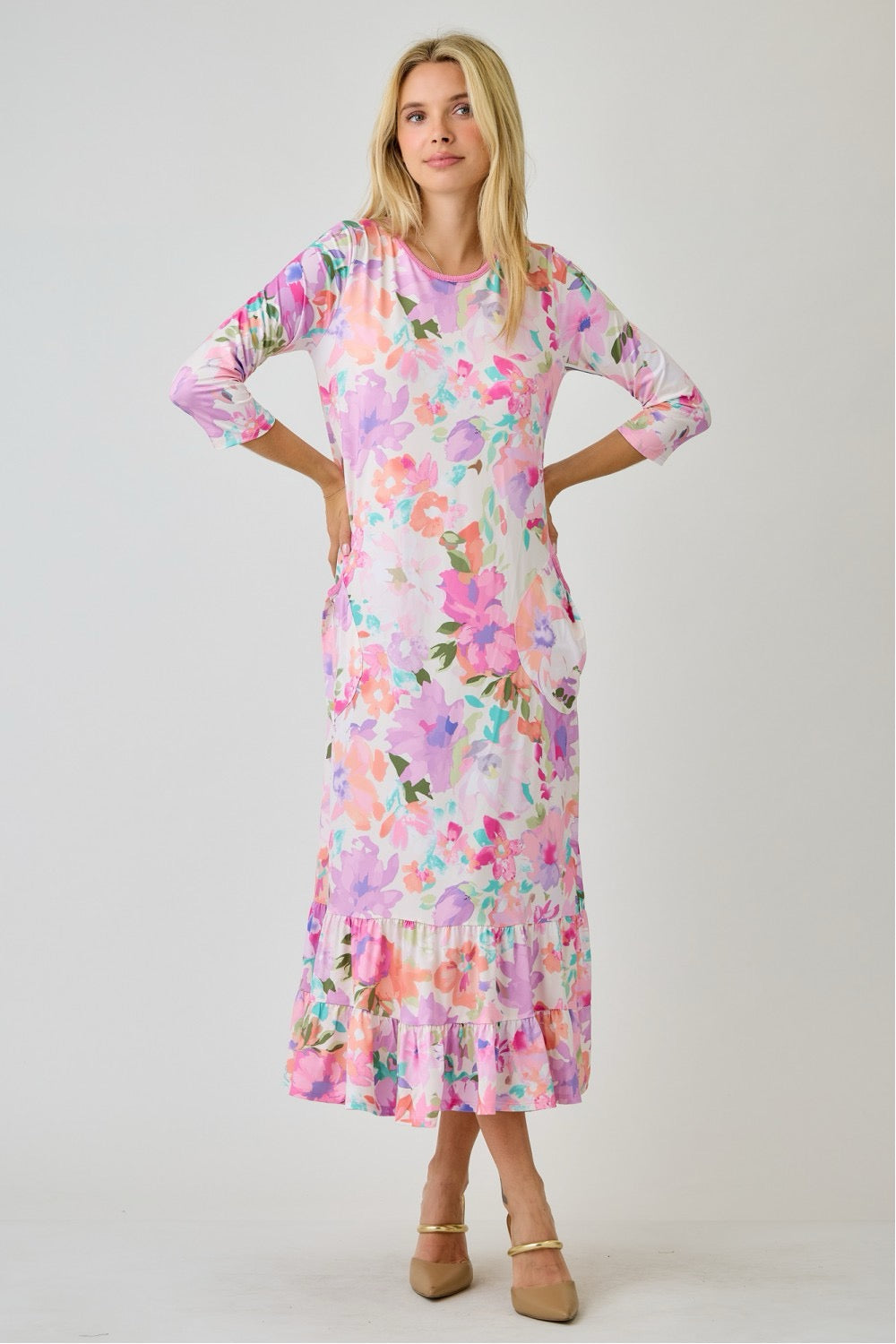Navy watercolor summer floral tiered ruffle dress with pockets from Celeste Clothing, displayed on a hanger.