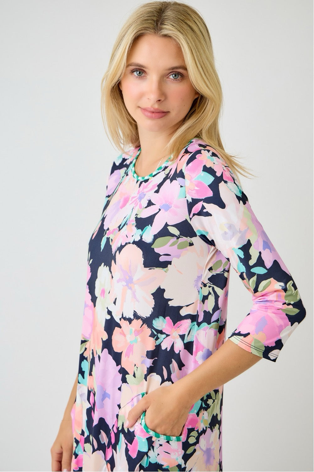 Navy watercolor summer floral tiered ruffle dress with pockets from Celeste Clothing, featuring a sleeveless design and floral pattern.
