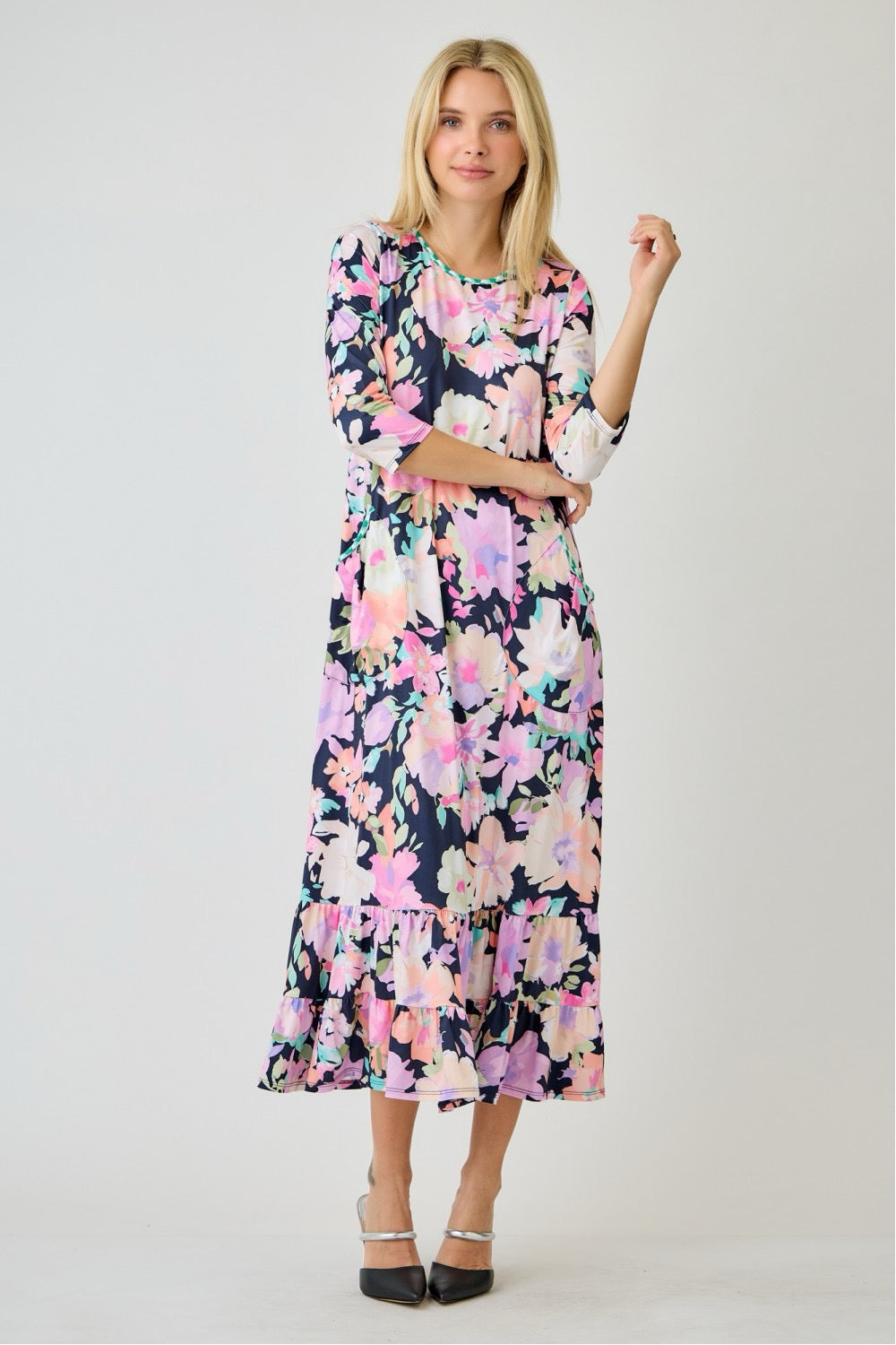 Navy watercolor floral tiered ruffle dress with pockets by Celeste Clothing, perfect for summer, shown on a hanger.