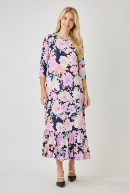 Navy watercolor floral tiered ruffle dress with pockets from Celeste Clothing, perfect for summer, displayed on a hanger.