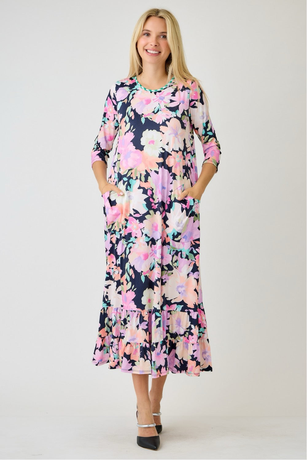 Navy watercolor floral tiered ruffle dress with pockets from Celeste Clothing, perfect for summer, shown on a model.