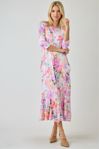 Navy watercolor floral tiered ruffle dress with pockets from Celeste Clothing, perfect for summer, shown on a model.