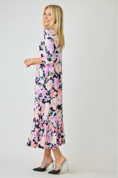 Navy watercolor floral tiered ruffle dress with pockets from Celeste Clothing, perfect for summer, shown on a model.