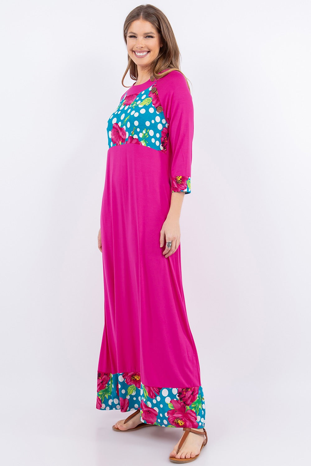 Fuschia 3/4 sleeve maxi dress by Celeste Clothing with floral and polka dot accents, flowing fabric and elegant design.