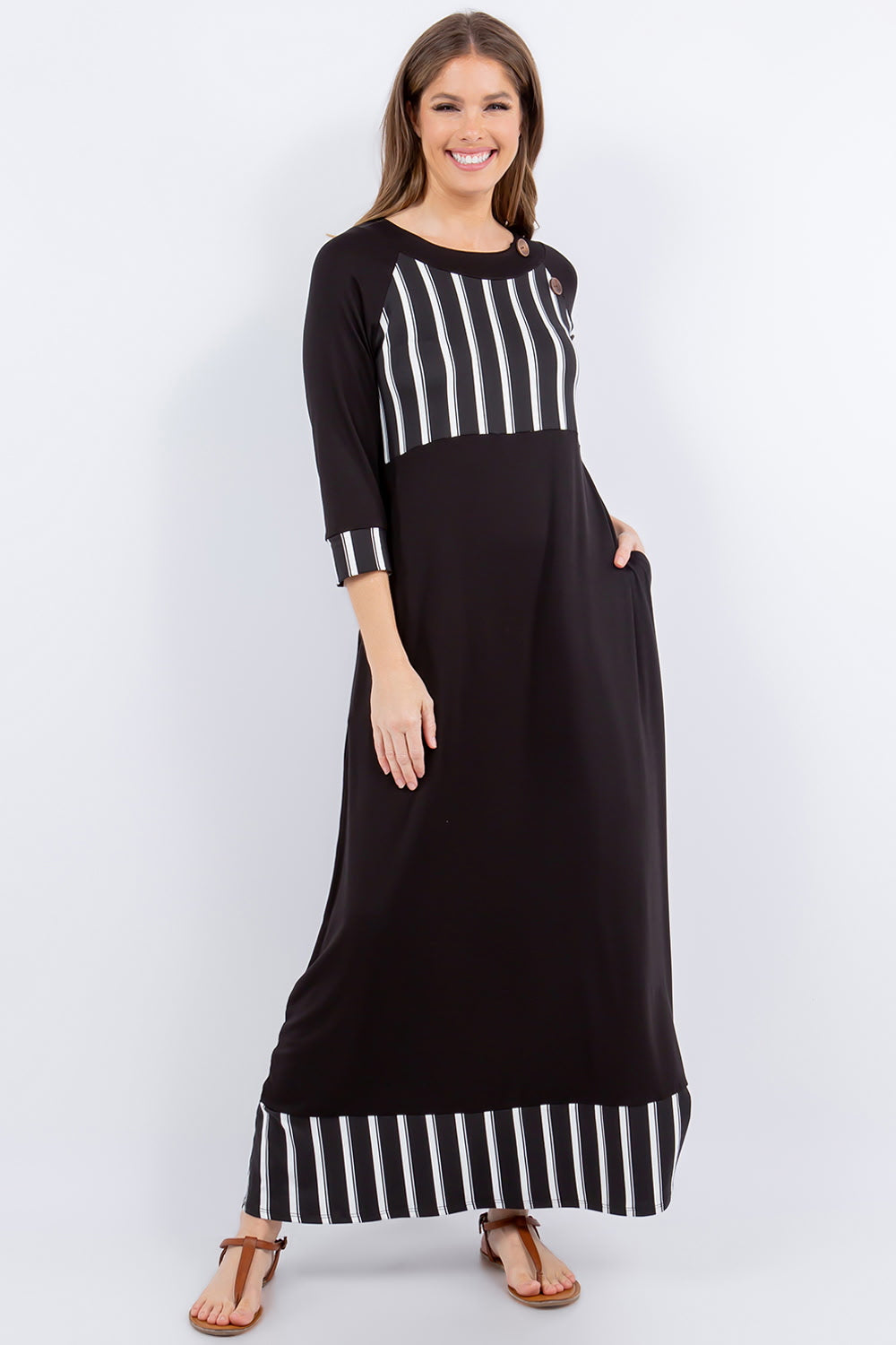 Black and white striped 3/4 sleeve maxi dress from Celeste Clothing, featuring a stylish stripe accent and flowing silhouette.