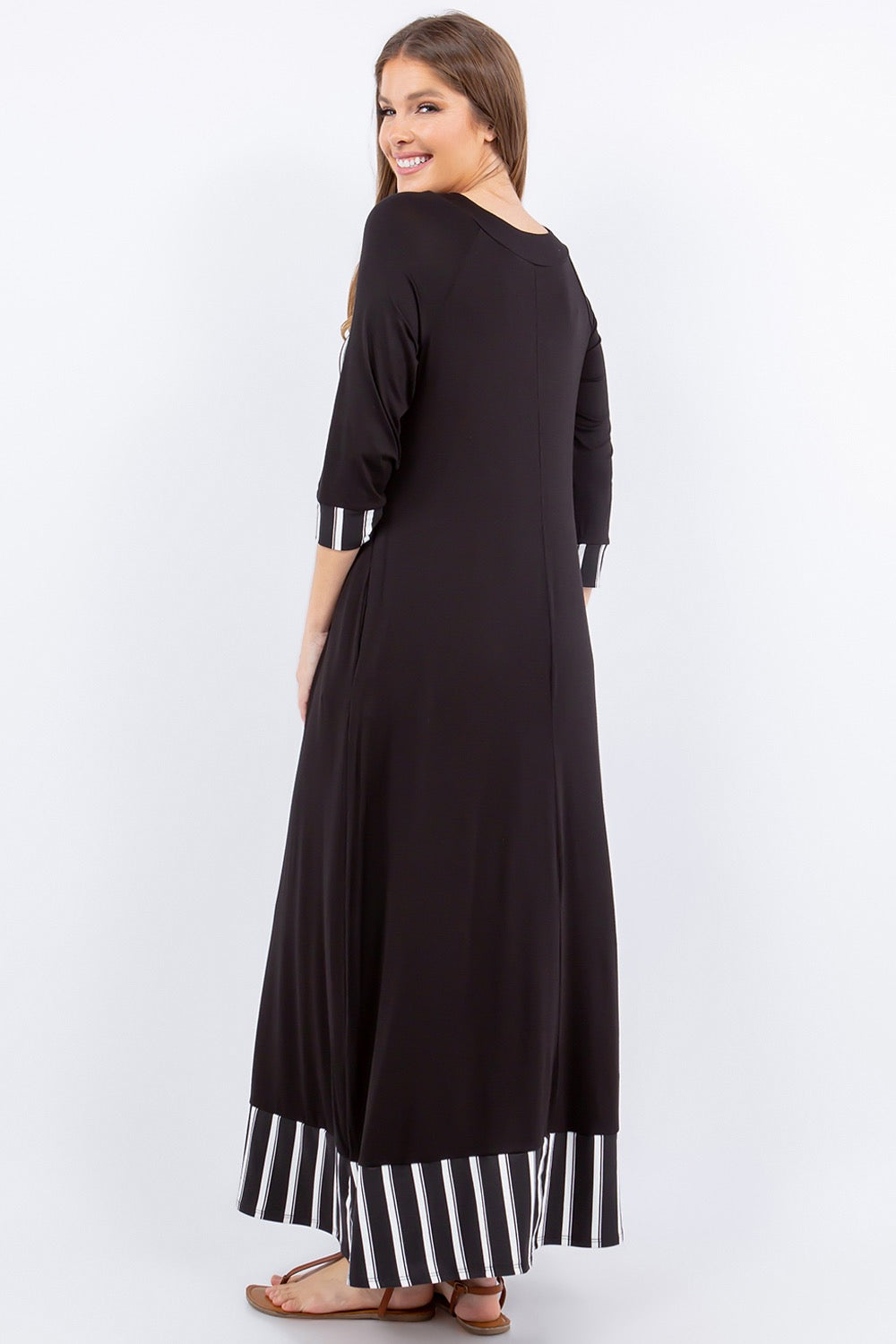 Black and white striped 3/4 sleeve maxi dress by Celeste Clothing, featuring a stylish stripe accent and flowing silhouette.