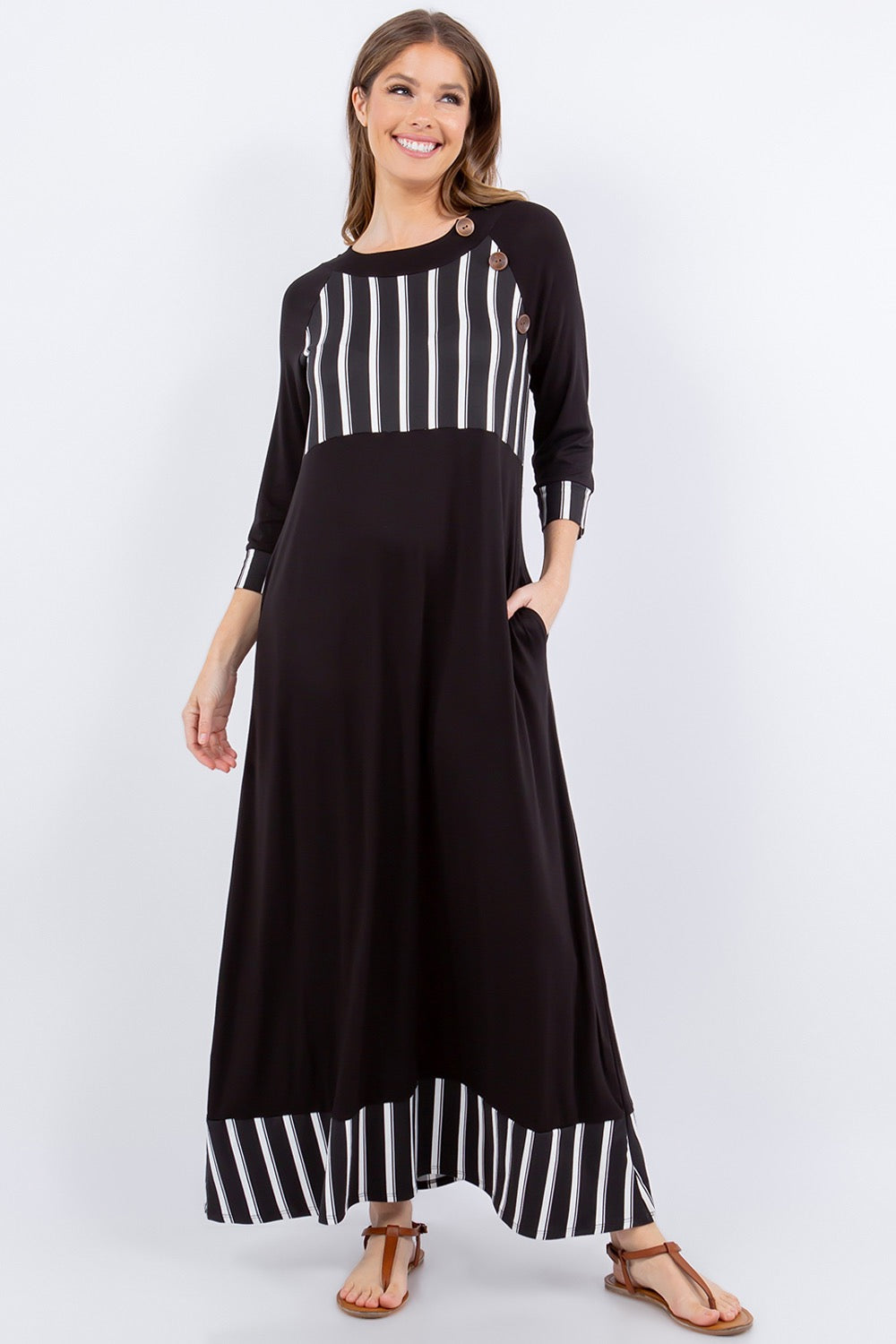 Black and white striped 3/4 sleeve maxi dress by Celeste Clothing, featuring a stylish stripe accent in a flowing dress style.