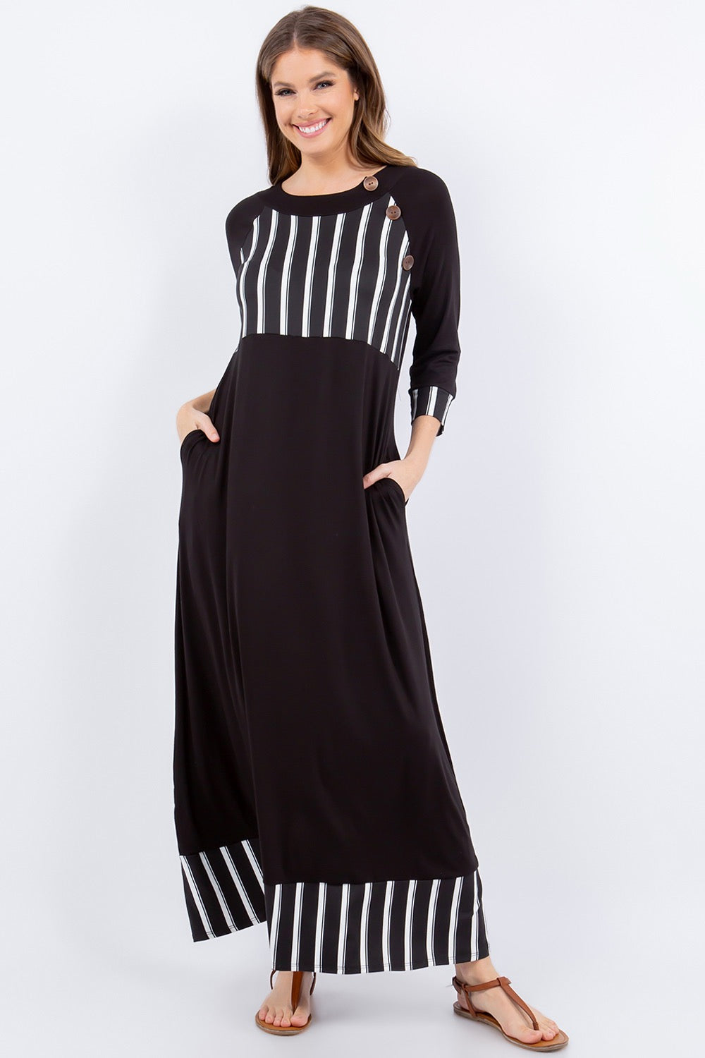 Black and white striped 3/4 sleeve maxi dress by Celeste Clothing, featuring a stylish stripe accent and flowing silhouette.