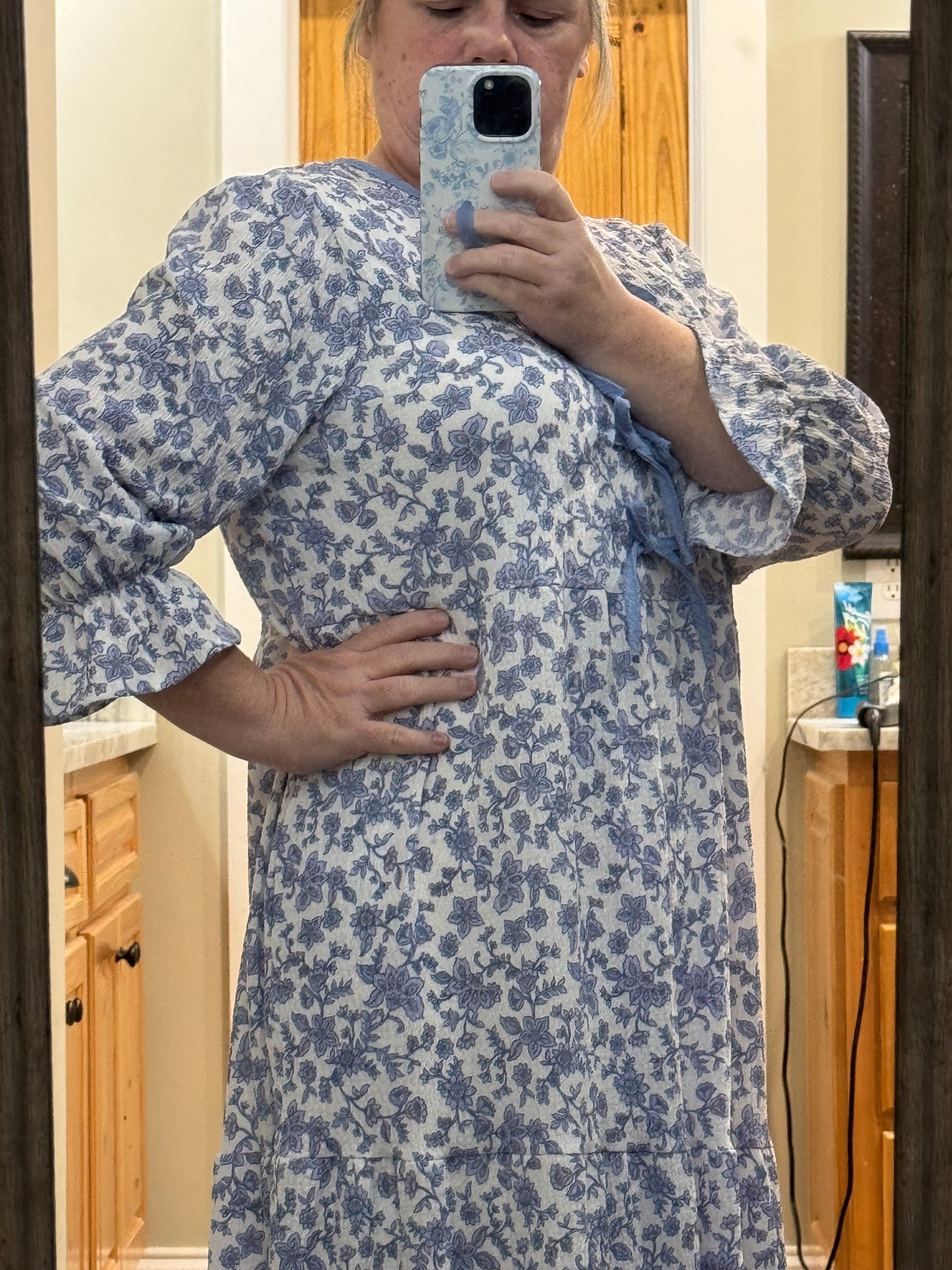 French blue floral maxi dress by Celeste Clothing featuring gauze-like fabric and a bow accent, perfect for elegant summer wear.