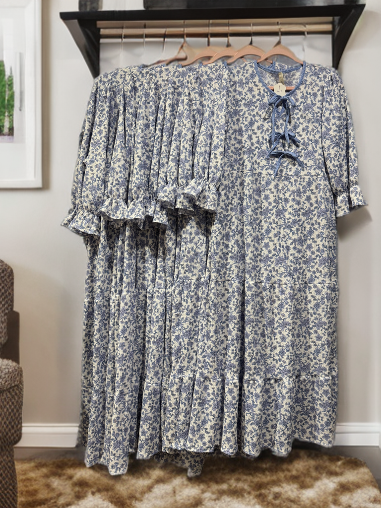 French blue floral maxi dress by Celeste Clothing featuring gauze-like fabric and a bow accent, perfect for elegant summer wear.