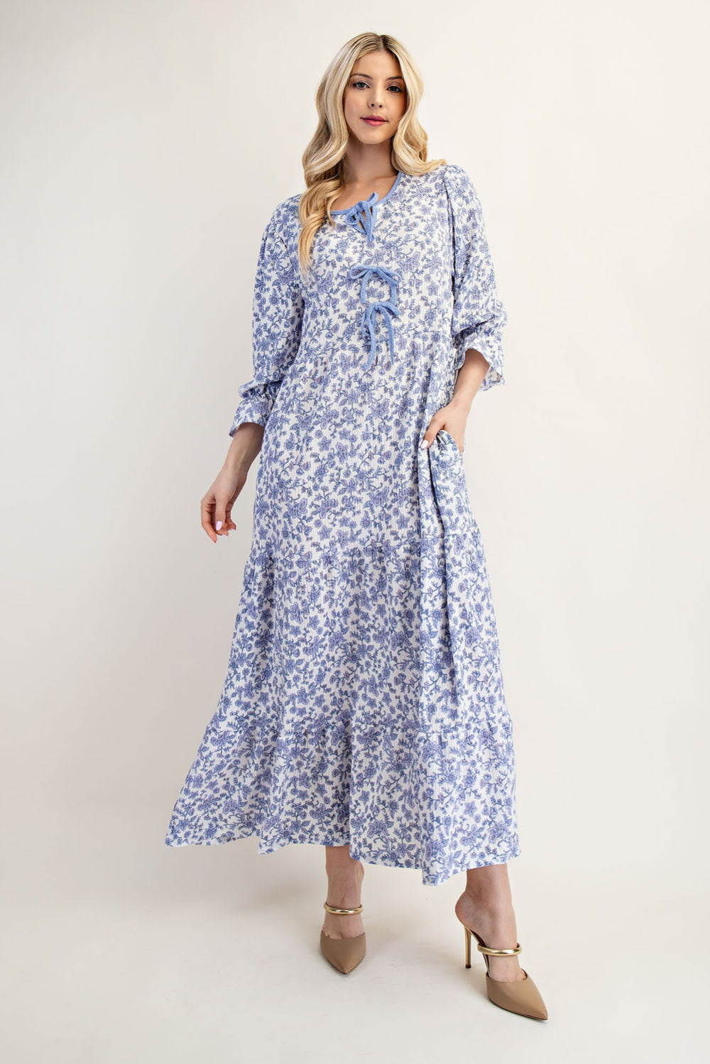 French blue floral maxi dress by Celeste Clothing featuring gauze-like fabric and a bow accent, perfect for elegant summer wear.