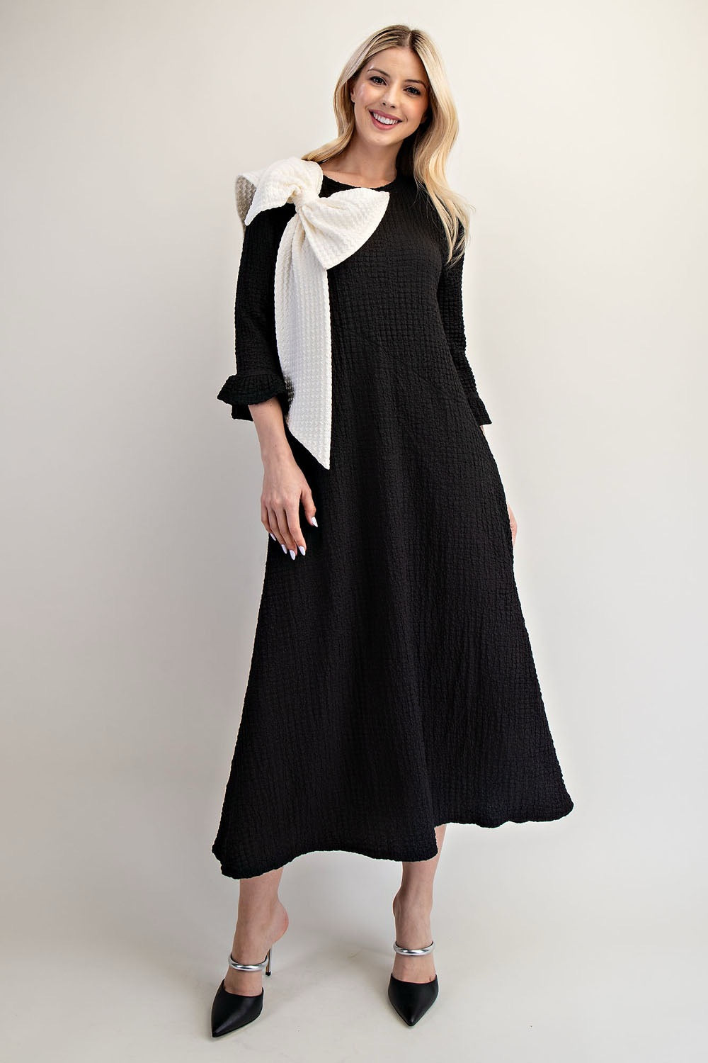 Celeste Clothing Glam Big Bow Dress, a stylish dress with a large bow detail, perfect for elegant occasions.