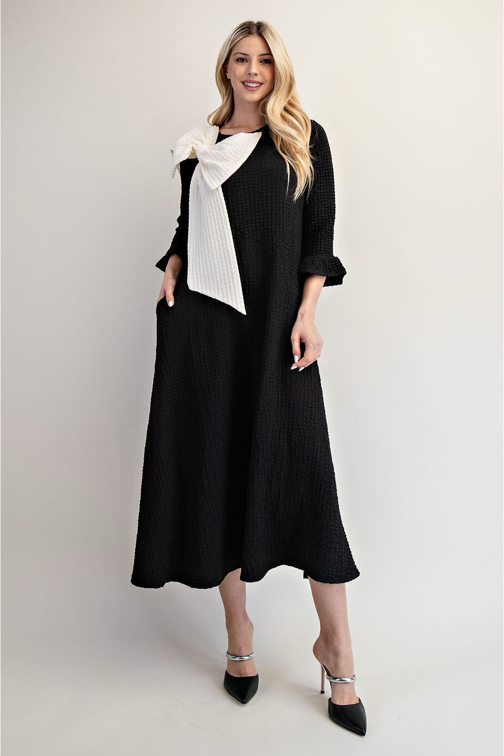 Celeste Clothing Glam Big Bow Dress, a stylish dress with a large bow detail, perfect for elegant occasions.
