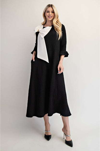 Celeste Clothing Glam Big Bow Dress, a stylish dress with a large bow detail, perfect for elegant occasions.