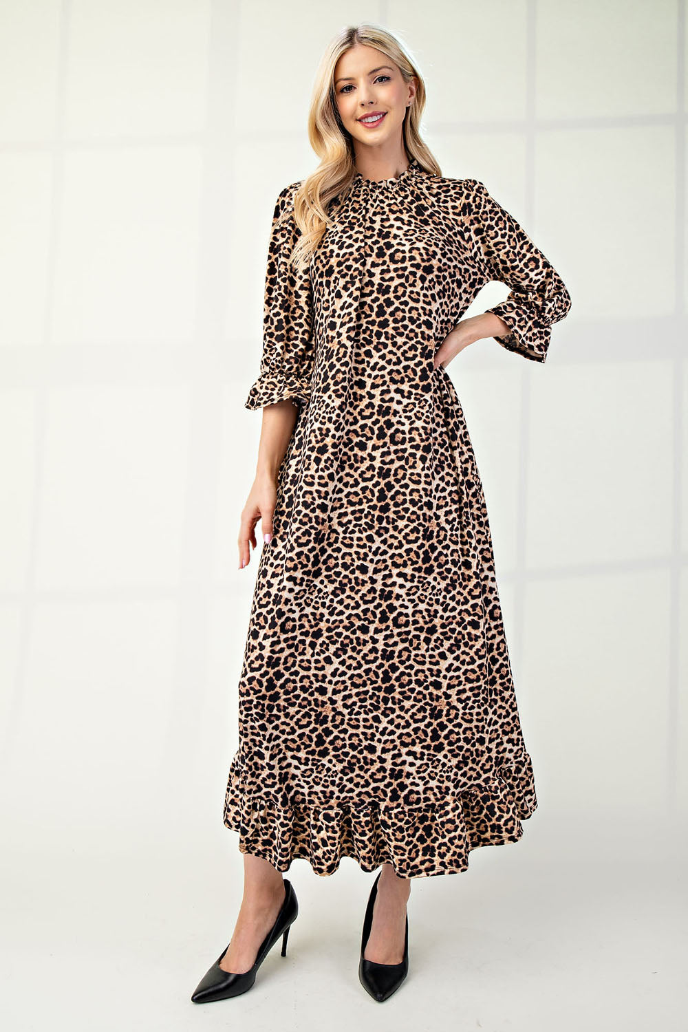 Plus size leopard print dress by Celeste Clothing with 3/4 sleeves and ruffle trim, casual and stylish for any occasion.