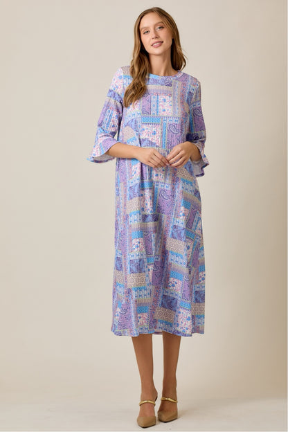 Lilac Modest A-Line Patchwork Print Dress by Celeste Clothing, featuring a flowing silhouette and colorful patchwork pattern.