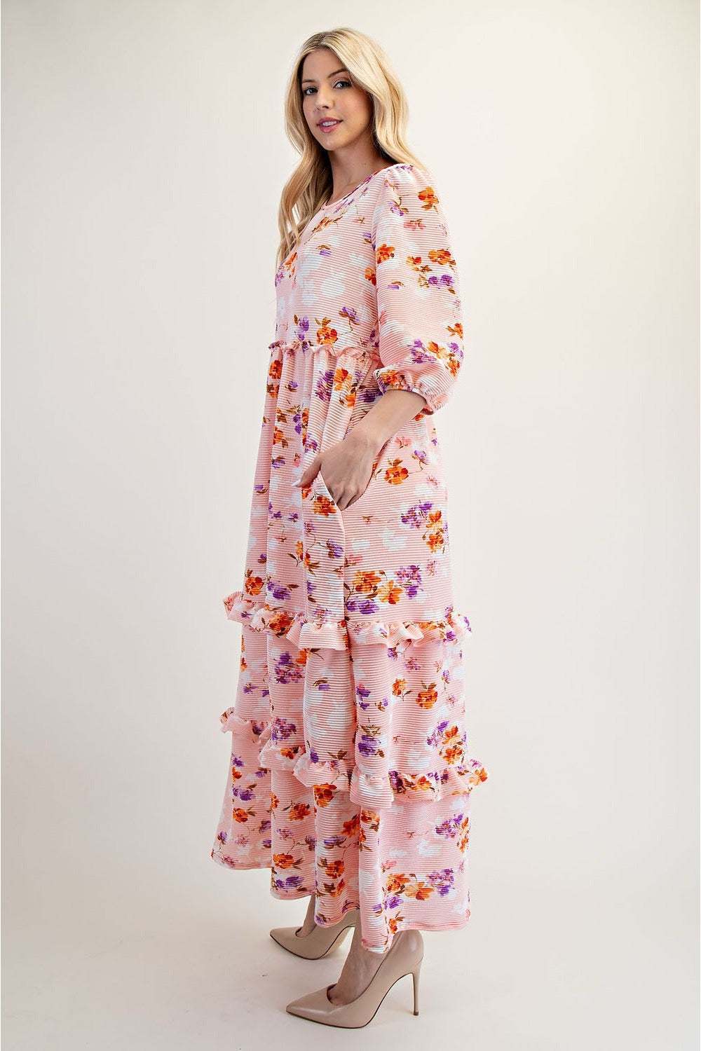 Peach modest floral tiered maxi dress from Celeste Clothing, featuring a flowing silhouette and elegant floral pattern.