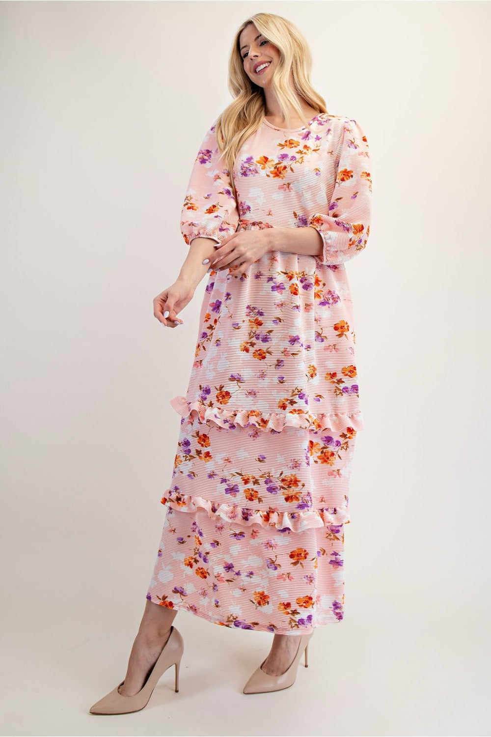 Peach floral tiered maxi dress from Celeste Clothing, featuring modest design and flowing fabric, perfect for elegant summer wear.