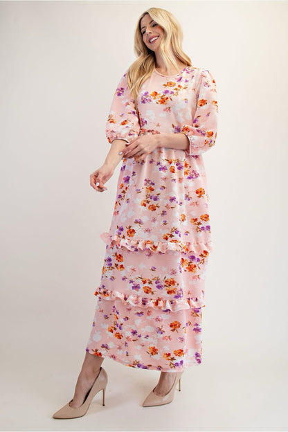 Peach floral tiered maxi dress from Celeste Clothing, featuring modest design and flowing fabric, perfect for elegant summer wear.