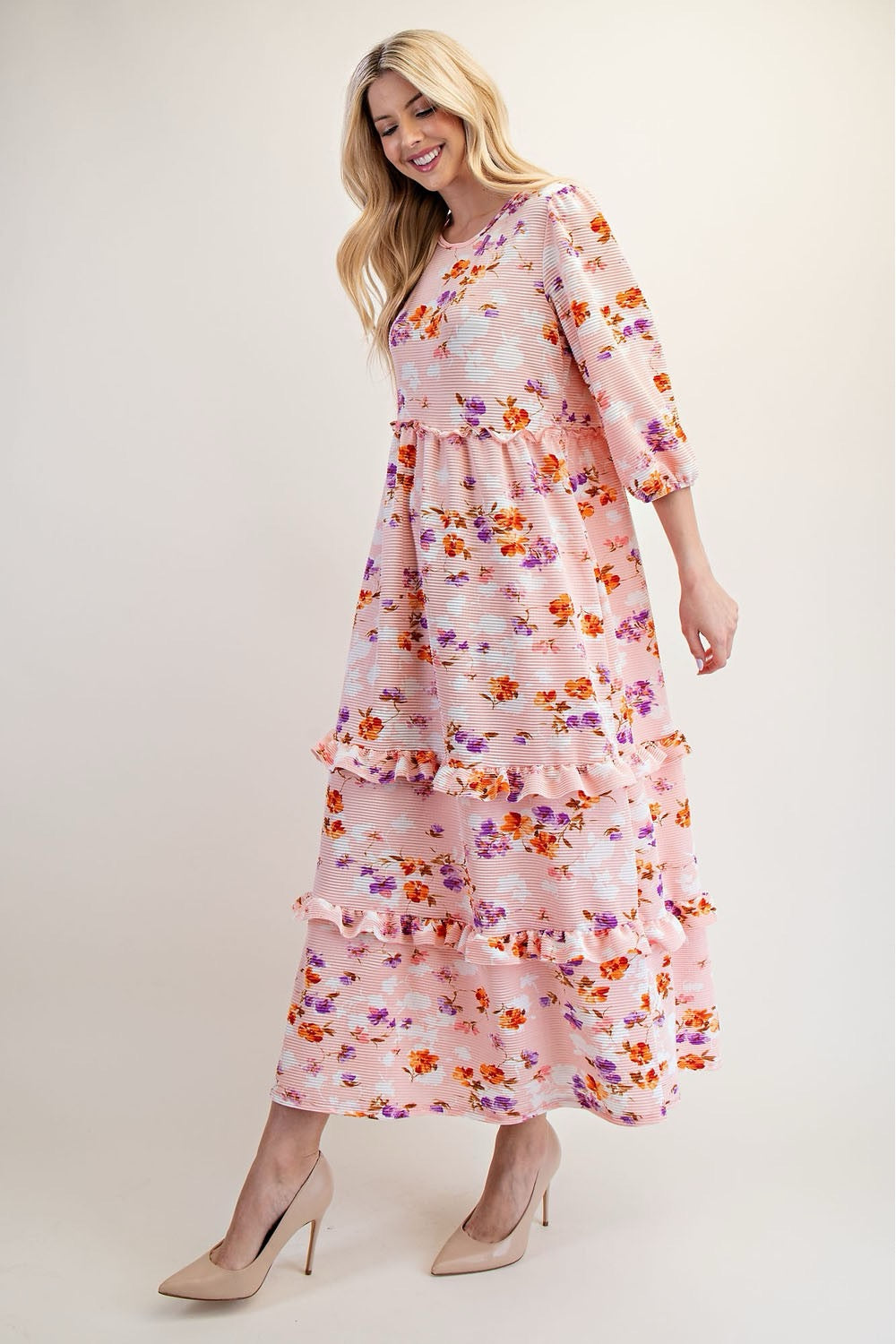Peach floral tiered maxi dress from Celeste Clothing, featuring modest design and flowing fabric, perfect for elegant summer wear.