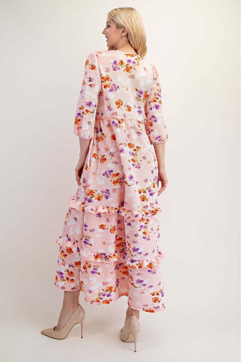 Peach floral tiered maxi dress by Celeste Clothing, featuring modest design and flowing fabric, perfect for elegant occasions.
