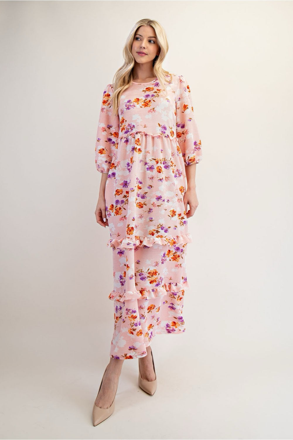 Peach floral tiered maxi dress by Celeste Clothing, modest style with flowing fabric and feminine floral pattern.
