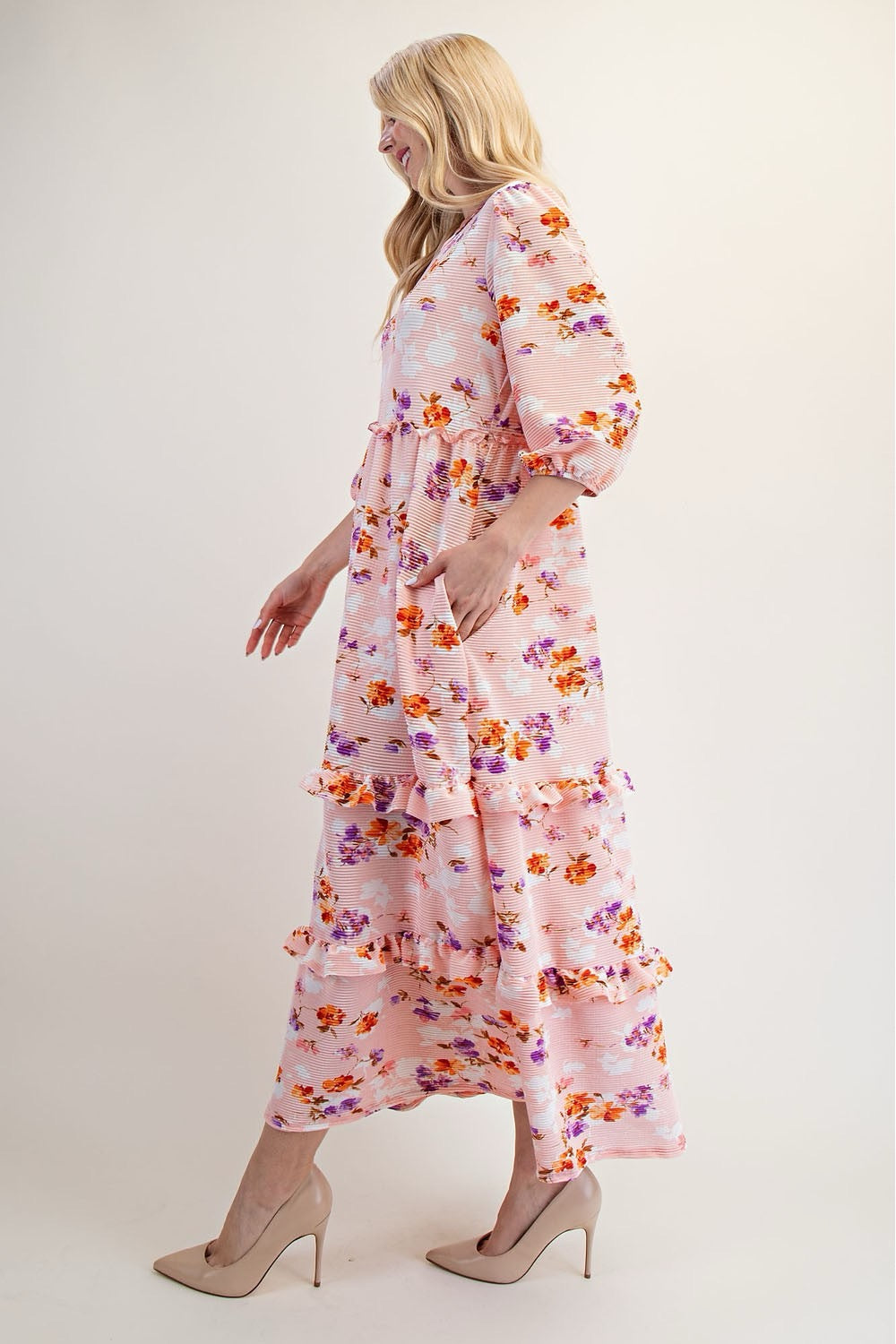 Modest floral tiered maxi dress by Celeste Clothing in peach, featuring a flowing silhouette and floral pattern.