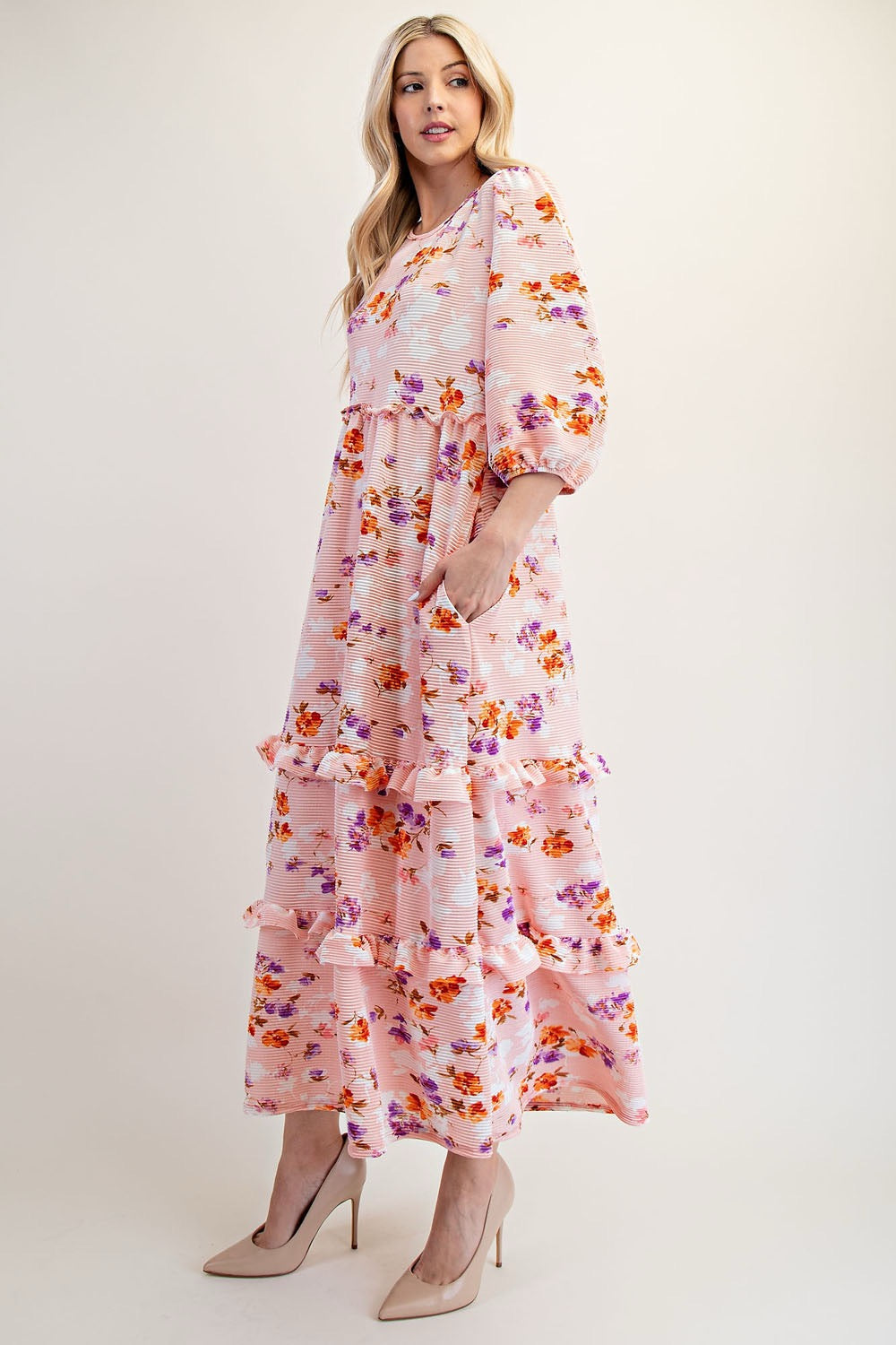 Peach floral tiered maxi dress by Celeste Clothing, featuring modest design and flowing fabric, perfect for elegant occasions.