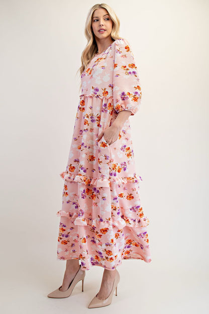 Peach floral tiered maxi dress by Celeste Clothing, featuring modest design and flowing fabric, perfect for elegant occasions.