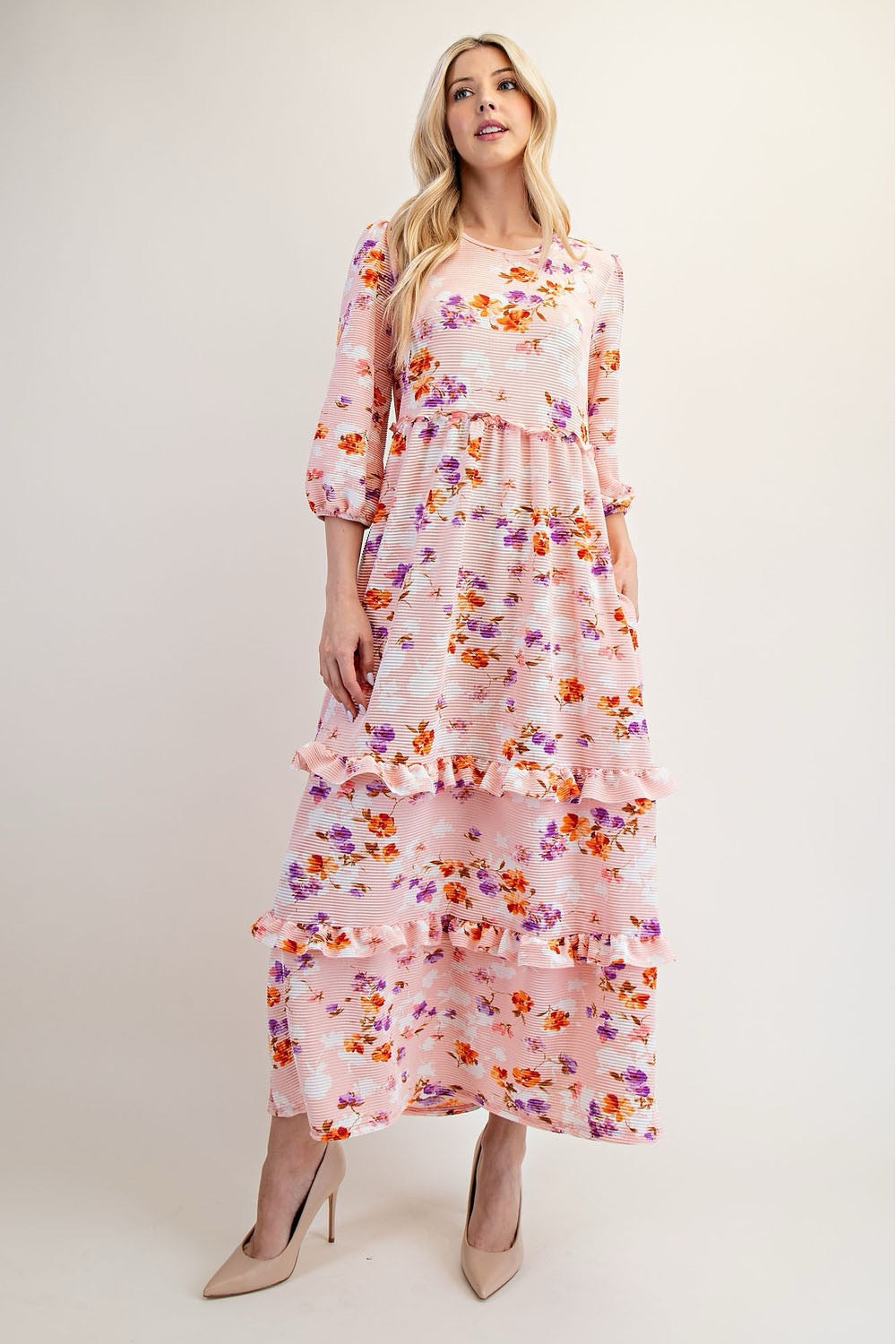 Modest floral tiered maxi dress from Celeste Clothing in peach, featuring a flowing, layered design and delicate floral pattern.