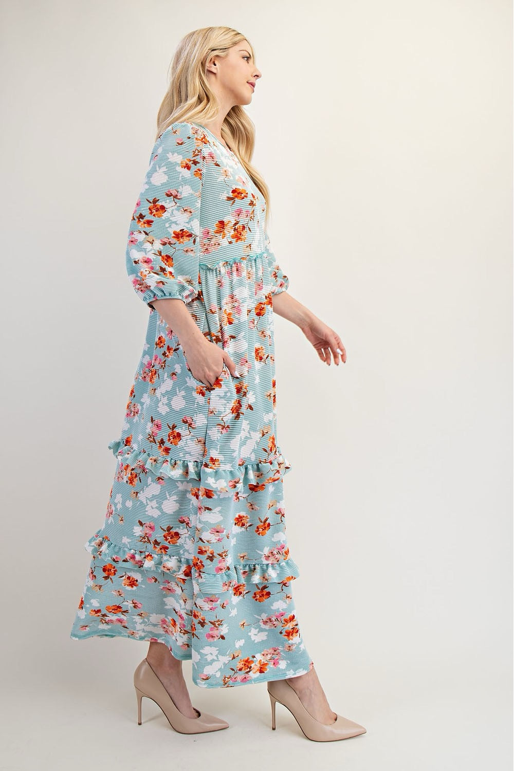 Modest floral tiered maxi dress from Celeste Clothing in sage light teal, showcasing a flowing, layered dress with a floral pattern.