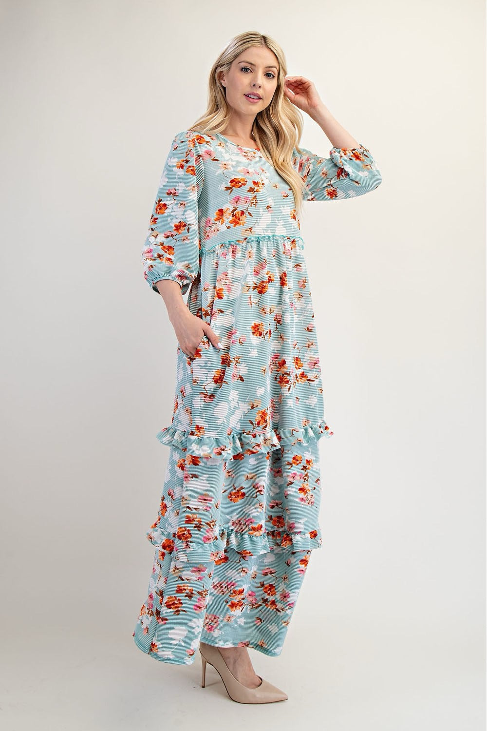 Modest floral tiered maxi dress from Celeste Clothing in sage light teal, featuring a flowing silhouette and delicate floral pattern.